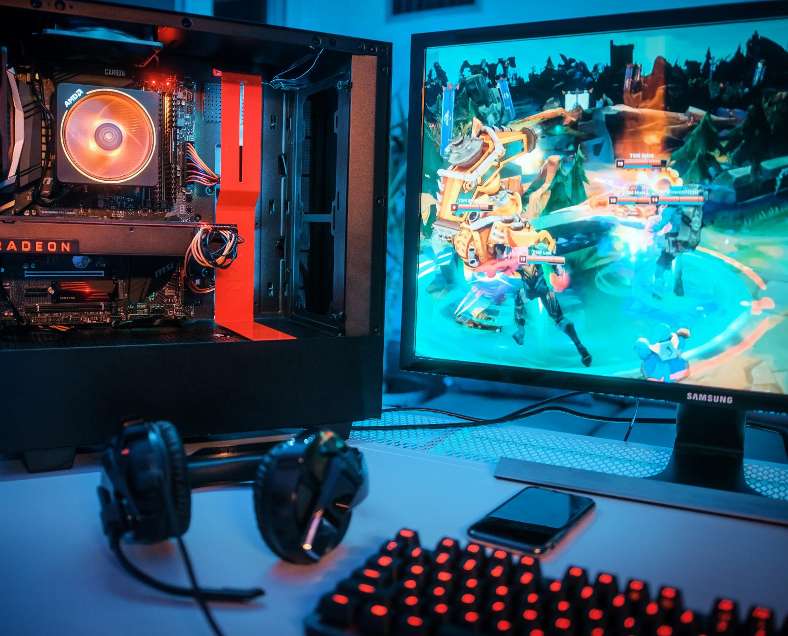 A streaming desk mid-broadcast with dual monitors and a boom-arm mic