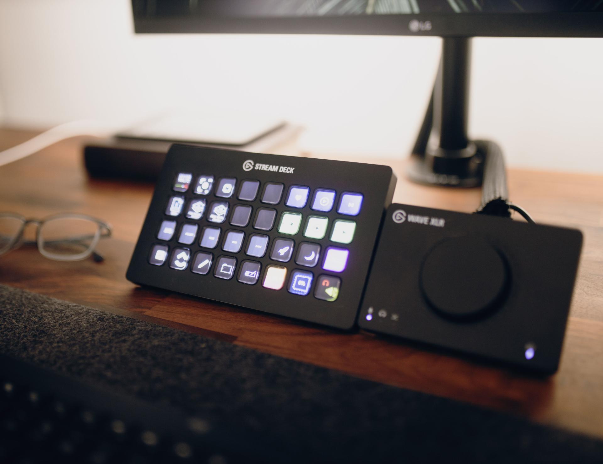 A hand adjusting a fader on a stream deck or audio mixer